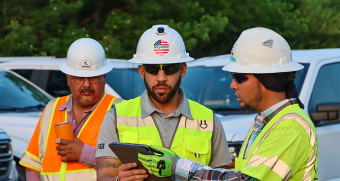 HexArmor sales associates enaging customers on a worksite.