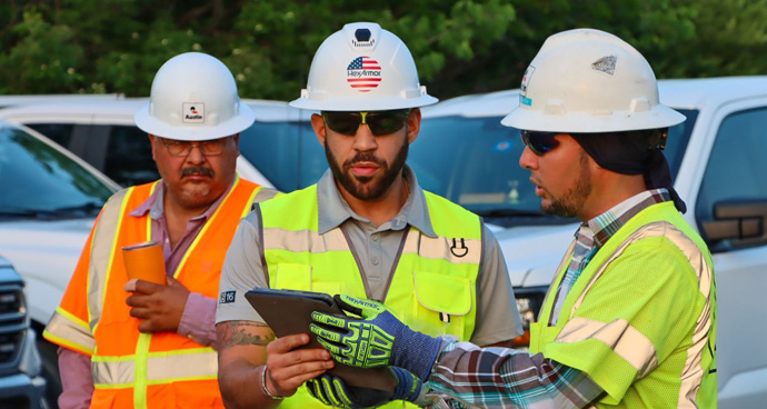 HexArmor sales associates enaging customers on a worksite.