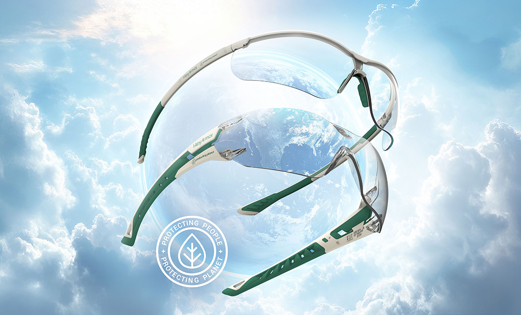 HexArmor's Planet Series Eyewear floating in clouds with a sustainability logo, showing the environmentally friendly design.
