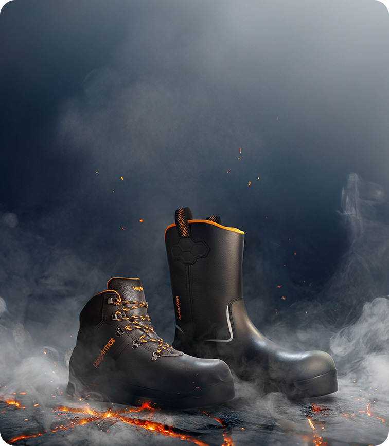 HeatArmor™ safety footwear surrounded by smoke and laying on hot asphalt.