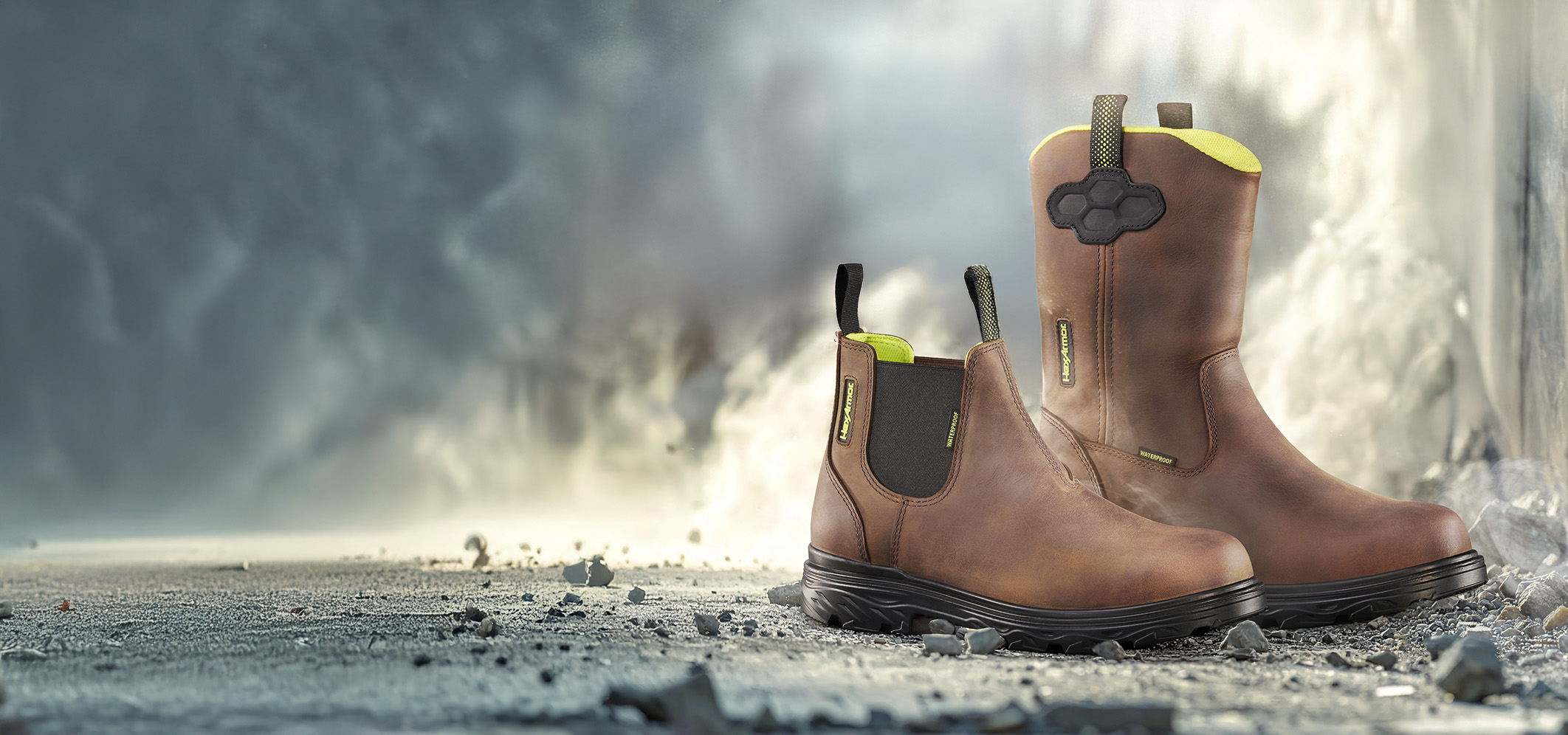 Xbuilt safety footwear sitting on cement at a construction site