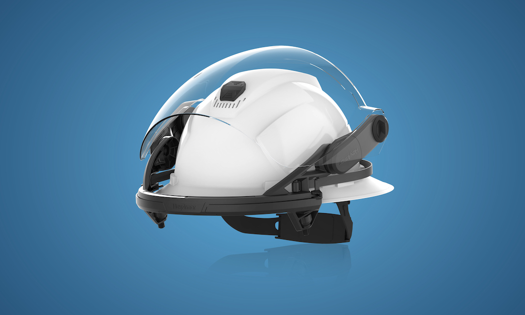 View of TruSpan universal face shield nesting tightly against the top of a safety helmet, with no catch hazards.